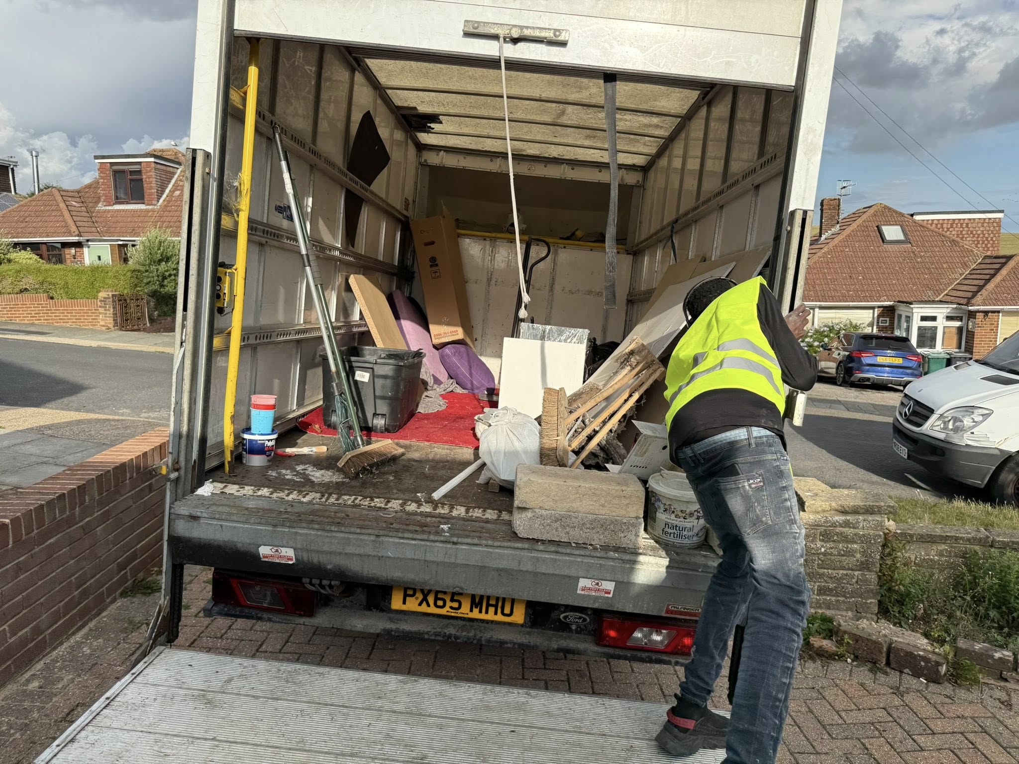 Team loading boxes into a van
